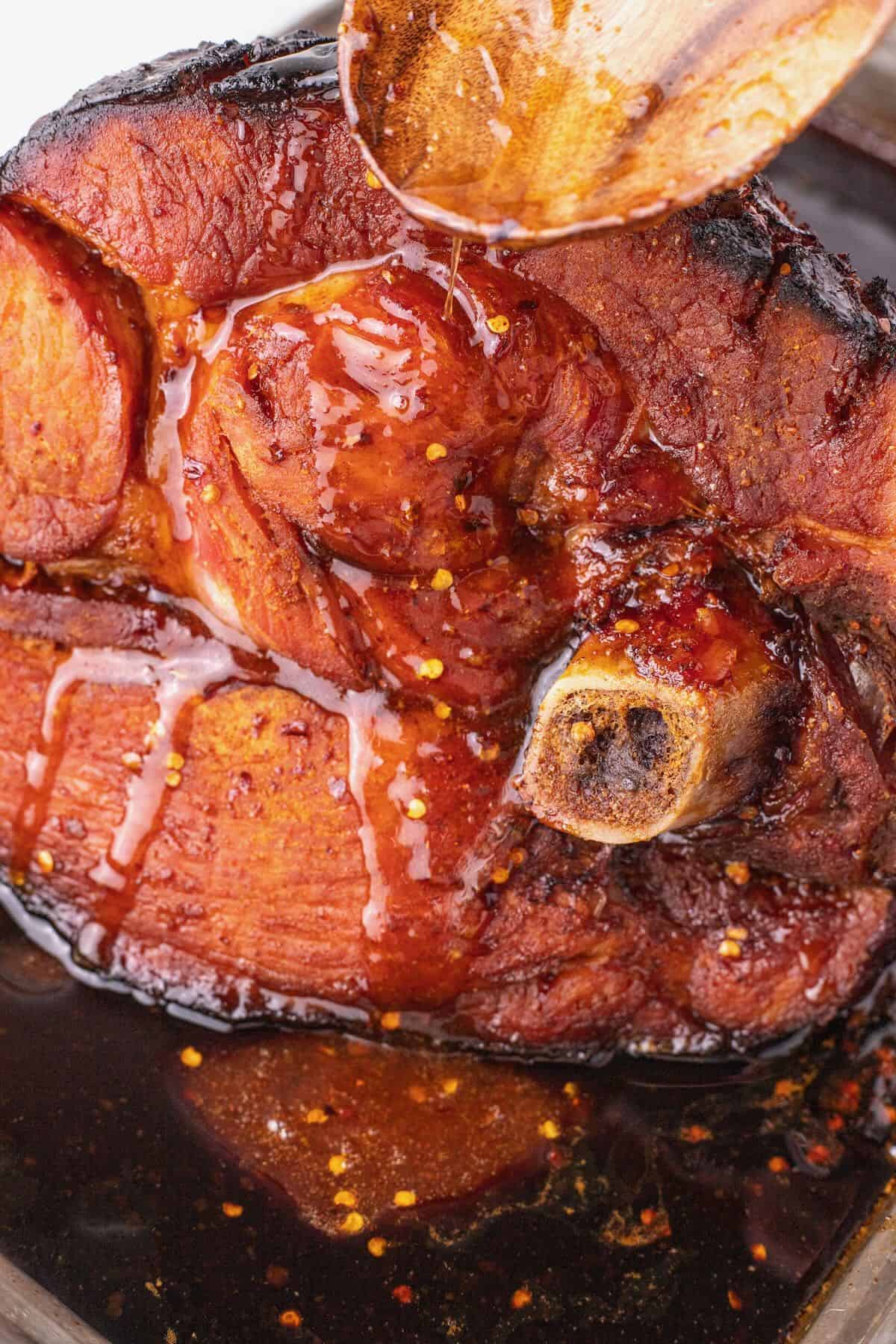 A whole ham with spicy maple syrup glaze with honey and brown sugar. 